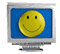 A spinning computer with a smiley face on the screen.